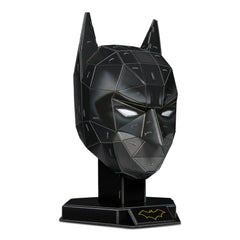 4D Build DC Batman mask puzzle model kit in black with a textured surface and yellow bat symbol, angled towards the viewer.