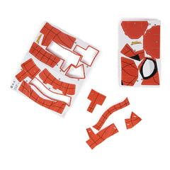 4D Build Marvel Spider-Man 3D puzzle model kit featuring scattered red plastic pieces on a white background.