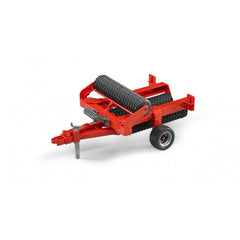 Red Bruder Cambridge Roller toy with black rollers and wheels, featuring a metal frame and realistic farming details.