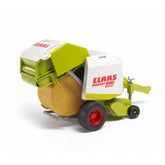 Bruder Claas Rollant 250 Straw Baler toy with green and white details, featuring a realistic round bale and red wheels.
