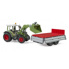 Green toy tractor with frontloader attached to a red and gray tipping trailer, showcasing realistic farm vehicle design.