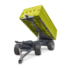 Bruder Fliegl Three-Way Dumper toy with green removable top, black chassis, and large treaded wheels.