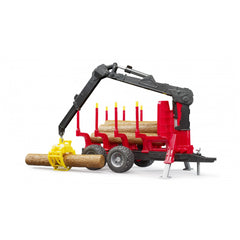 Bruder forestry trailer with red frame, black loading crane, and yellow grab holding a wooden trunk.