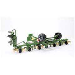 Green Bruder Krone Trailed Rotary Tedder model with realistic wheels and detailed rotary elements on a white background.
