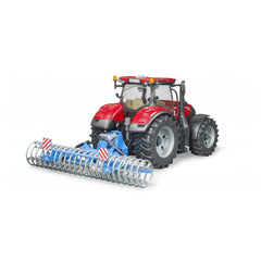 Red toy tractor with large black tires and a blue Lemken front furrow press, featuring white rings and red stripes.