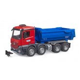 Red and blue Bruder MB Arocs halfpipe tipper truck with detailed cabin and multiple wheels on a white background.