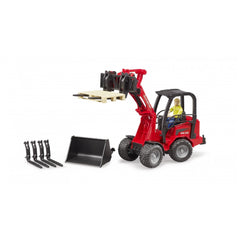 Red Bruder Schäffer Compact Loader 2630 with figure, lifting a pallet. Includes additional bucket and forks for versatility.