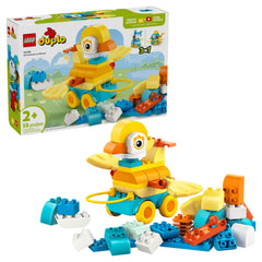 Colorful LEGO DUPLO 3in1 Animals on Wheels construction set featuring a duck on wheels, surrounded by various building blocks.