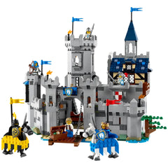 Medieval castle playset with knights, flags, and detailed structures; features a drawbridge, treasure chest, and horses.