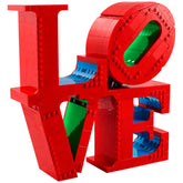 Colorful LEGO® Art LOVE construction set featuring large red letters 'L', 'O', 'V', 'E' with blue and green accents, arranged playfully.