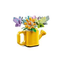 Colorful LEGO® Creator 3in1 Flowers in Watering Can set featuring a bright yellow watering can with vibrant flower and butterfly models.