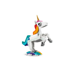A vibrant LEGO unicorn rearing on a colorful base, featuring a golden horn, a rainbow mane, and playful, posable legs.