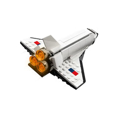 LEGO Creator 3in1 Space Shuttle featuring a sleek white design, three orange rocket boosters, and colorful accents on the wings.