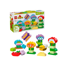 Colorful LEGO® DUPLO® Creative Garden & Flowers construction set featuring assorted bricks, flowers, and animal figures like a frog, butterfly, and bee.
