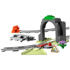 LEGO® DUPLO® Train Tunnel and Tracks Expansion Set featuring a gray tunnel, curved tracks, and colorful accessories like a traffic sign and a flower element.