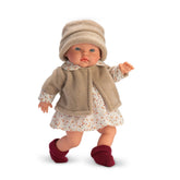 Alex doll from the Cherry Collection, in a beige fleece jacket, floral dress, and maroon booties, with light-colored eyes.