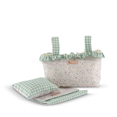 Green checkered doll diaper bag with floral pattern, filled with matching pillow and blanket.