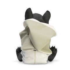 French Bulldog doll in a green raincoat sitting with back facing, wearing a diaper.