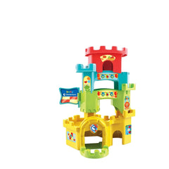 Baby Clementoni Ball Drop Castle features a multi-level plastic structure in yellow, red, green, and blue with smaller compon