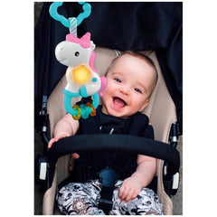 Baby Clementoni Magic Unicorn Light & Melodies in a stroller with a beige seat, featuring a baby in a black vest and patterne