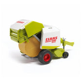 Bruder Claas Rollant 250 Straw Baler toy with green and white details, featuring a realistic round bale and red wheels.