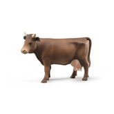 Brown toy cow figurine standing with head turned right, showing realistic farm details and pink udder.
