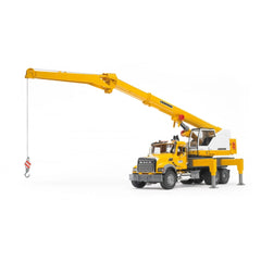 Yellow Bruder MACK Granite Liebherr crane truck toy with extendable boom and stabilizing support legs on white background.