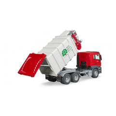 Red and white Bruder MAN TGS side-loading garbage truck toy with raised bin and open rear tailgate.