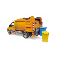 Orange toy waste disposal truck with open back, showing blue and yellow bins, Bruder decal on door, on white background.