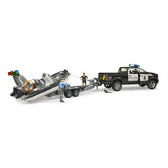 Bruder police pickup and boat trailer set with figurines, featuring realistic design and details in a play setting.