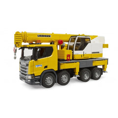 Yellow Bruder Scania Super 560R Liebherr crane truck toy with telescopic arm and realistic detailing, featuring six wheels.
