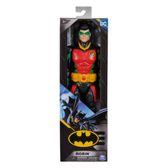 DC Comics Robin action figure stands in a colorful costume inside a packaging box with a clear window and scene design.