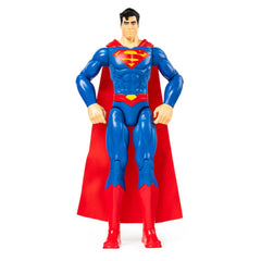 Superman action figure with a muscular build, wearing a blue suit and red cape, set against a plain light background.