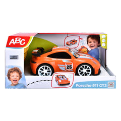 Dickie ABC remote-controlled Porsche 911 GT3 play vehicle packaging features an orange car and a child's image on a white bac