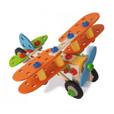 Eichhorn Constructor 4 in 1 construction set with 4 orange, 2 green, 2 blue, and 2 yellow plastic wings, plus wheels and dowe