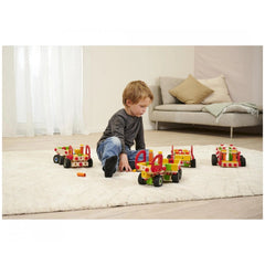 Eichhorn Constructor Truck construction set, featuring a young boy playing on a shaggy carpet with a colorful red and yellow