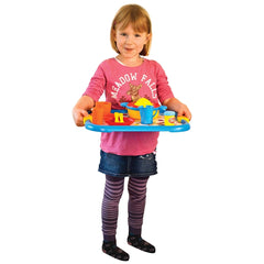 Gowi Coffee Service Lyon set with blue tray, bowl, cup, utensils, and a young girl in a pink shirt and denim skirt.