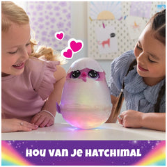 Hatchimals Alive Mystery Hatch Pufficorn plush toy with lights and sounds is being joyfully played with by two smiling girls.