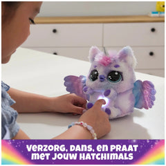 Hatchimals Alive Mystery Hatch Pufficorn plush toy in purple with blue and pink accents, held by a young girl indoors.