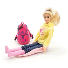 Doll with blonde hair in a yellow sweatshirt, blue denim pants, pink shoes, and a pink backpack with sunglasses.
