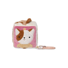 Jollein Activity Cube features a plush cat toy with a crown, pink floral keychain, and textured fabric on a light background.