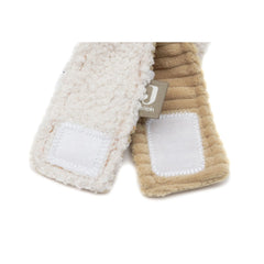 Wrist rattle featuring a tan fuzzy cat design with white fabric and stitching, ideal for sensory play and development.