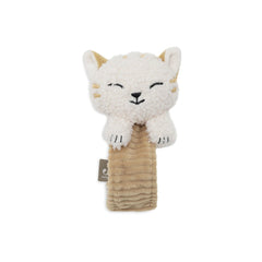 Jollein wrist rattle features a fluffy cat plush with cream ears, black eyes, and white paws, resting on a light brown fabric