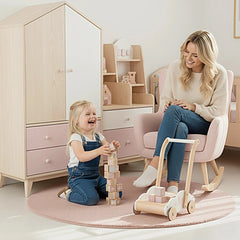 Label-Label educational baby walker features a smiling woman and child on a pink rug, with the child holding blocks and a woo