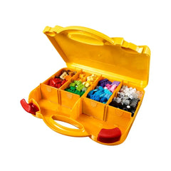 Colorful LEGO bricks sorted in compartments inside a yellow suitcase, featuring red clasps, ideal for creative play and organization.