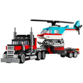 LEGO Creator Flatbed Truck with Helicopter set featuring a red and black truck towing a colorful helicopter with spinning rotors.
