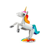 A majestic LEGO unicorn in white, featuring a golden horn, colorful mane, and a vibrant tail, rearing on a rainbow stand.