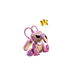 LEGO Angel building toy in pink and beige, featuring large ears and movable limbs, sits next to a yellow butterfly.