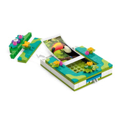 Lego Disney Encanto Mirabel's Photo Frame and Jewelry Box set, featuring a colorful jewelry box, a photo frame with a toucan image, and decorative flowers.