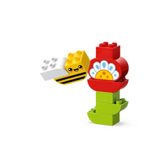 A colorful LEGO® DUPLO® flower build in red, green, and blue, with a smiling bee figure on the side, perfect for preschoolers.